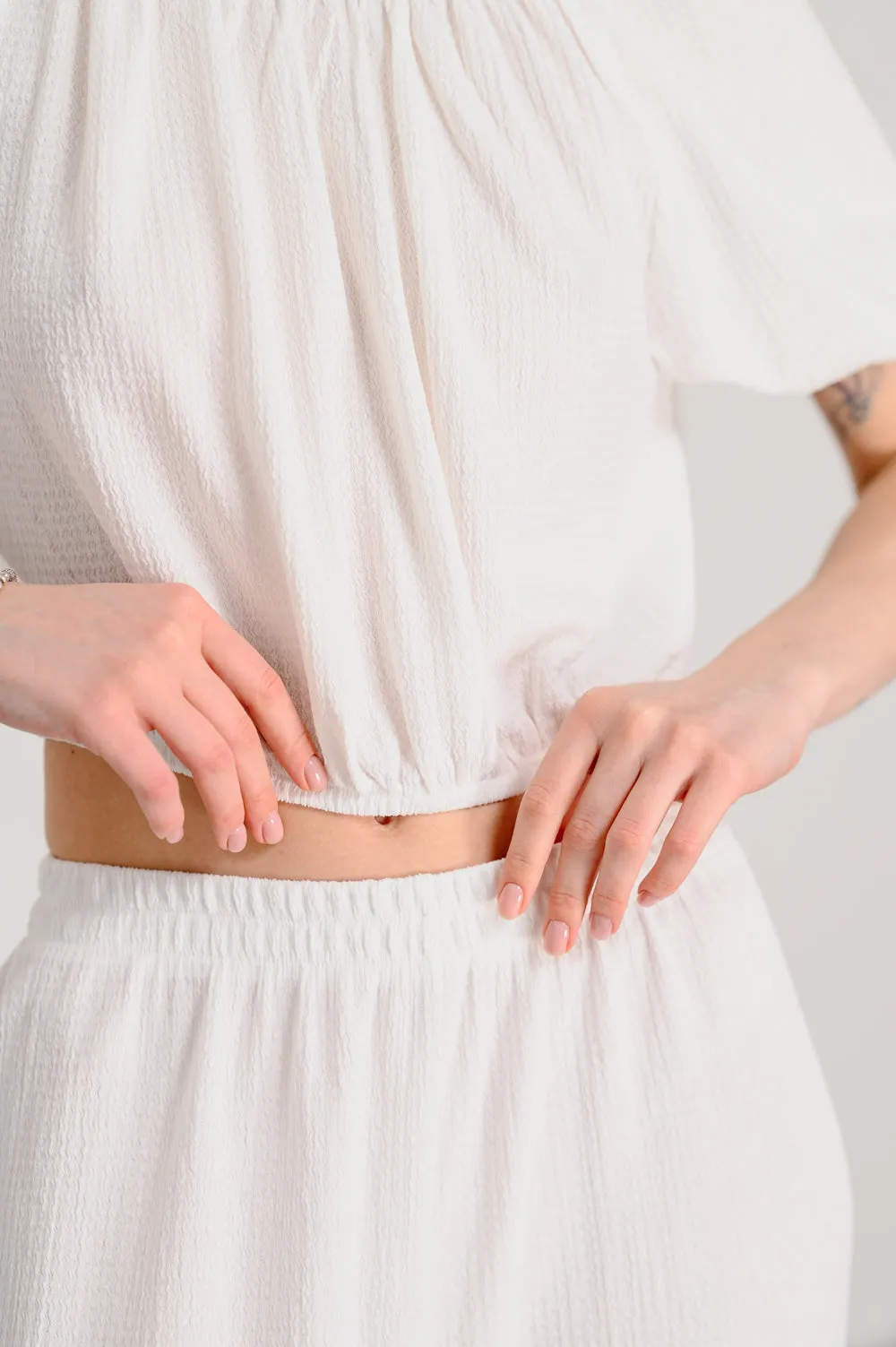 Loose two-piece suit in milky color